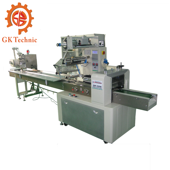 給人人帶來的配角不是巧克力，而是如下這款GK型號的巧克力反轉(zhuǎn)展轉(zhuǎn)式枕式包裝機。